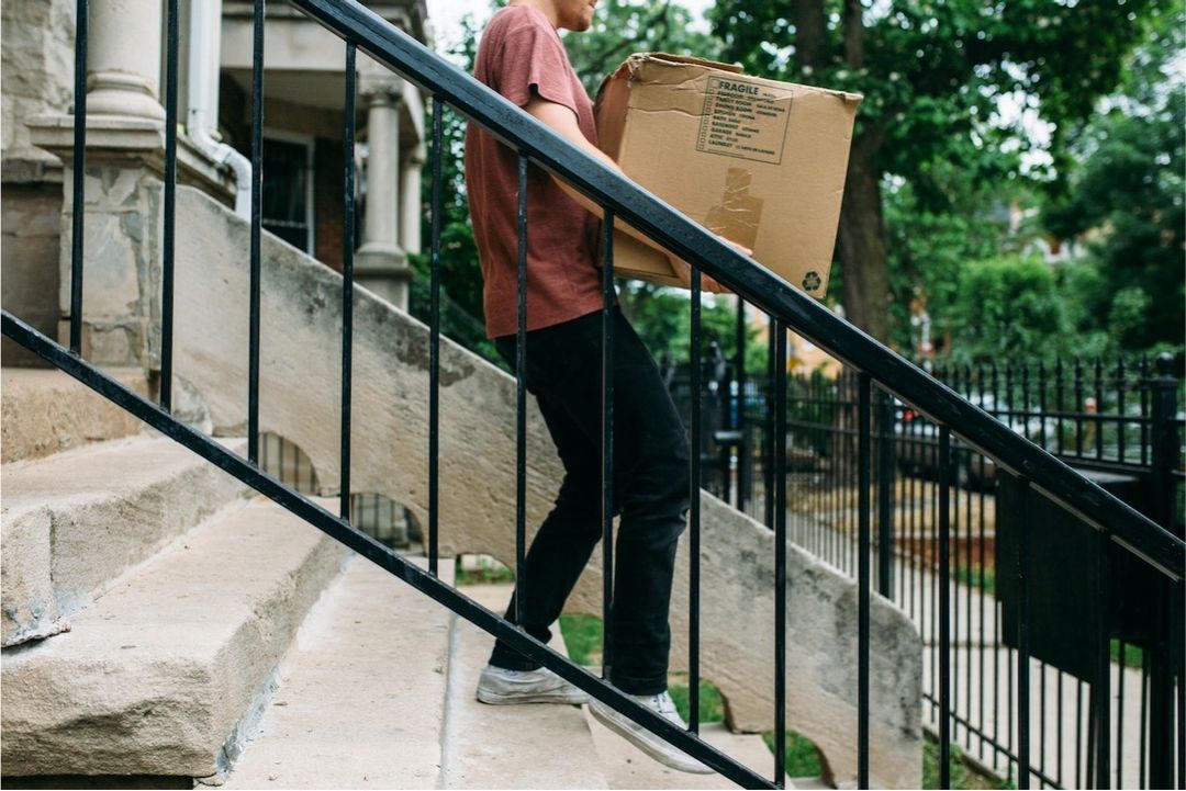 Homeowner packing boxes while planning their sale